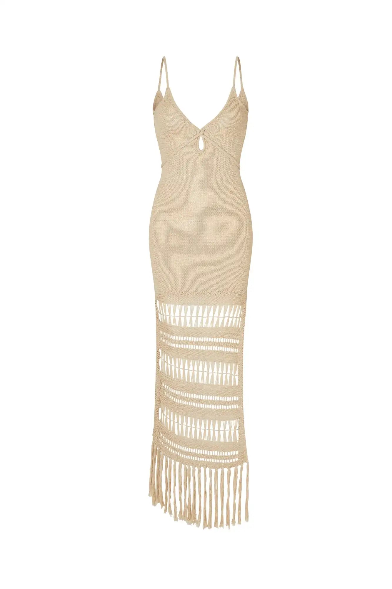 Beige cover up with fringe details on a white background