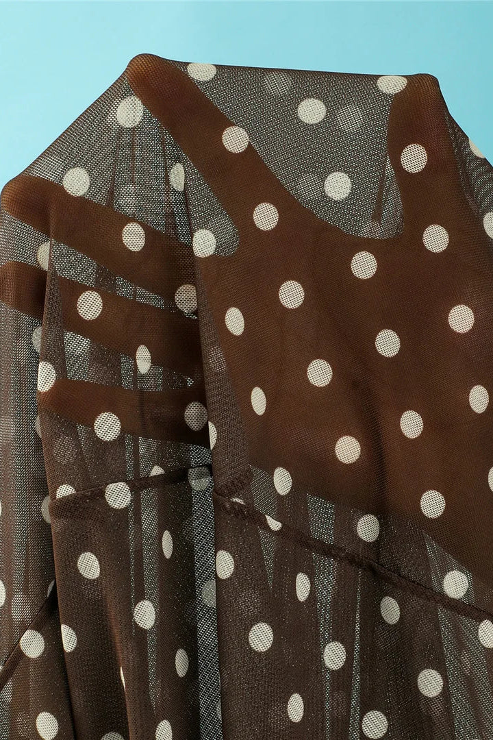 A close-up of a brown sheer mesh fabric with white polka dots, 