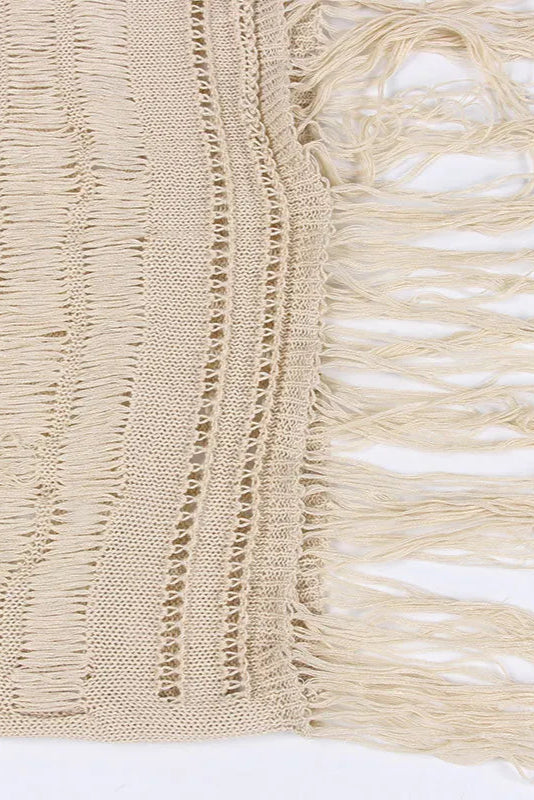 Beige woven fabric with fringe details on a white background