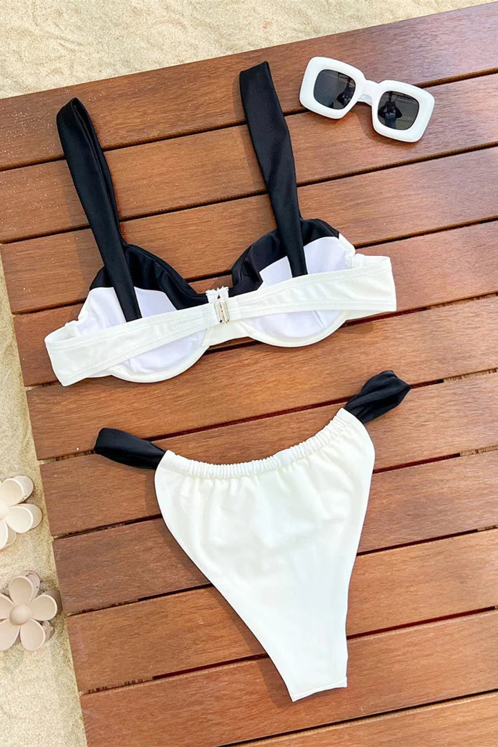Black and white bikini set perfect for poolside lounging and summer vacations.