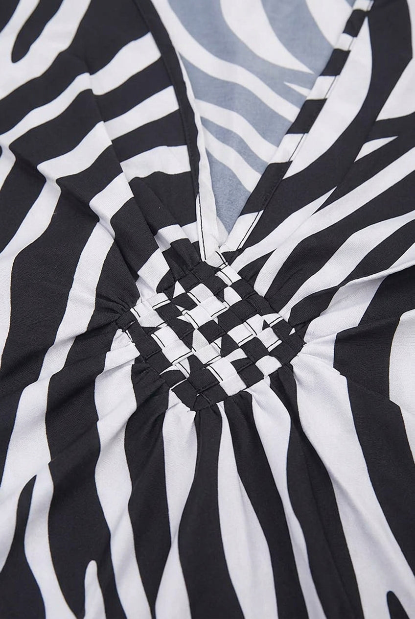 Black and white zebra print kaftan cover up close up