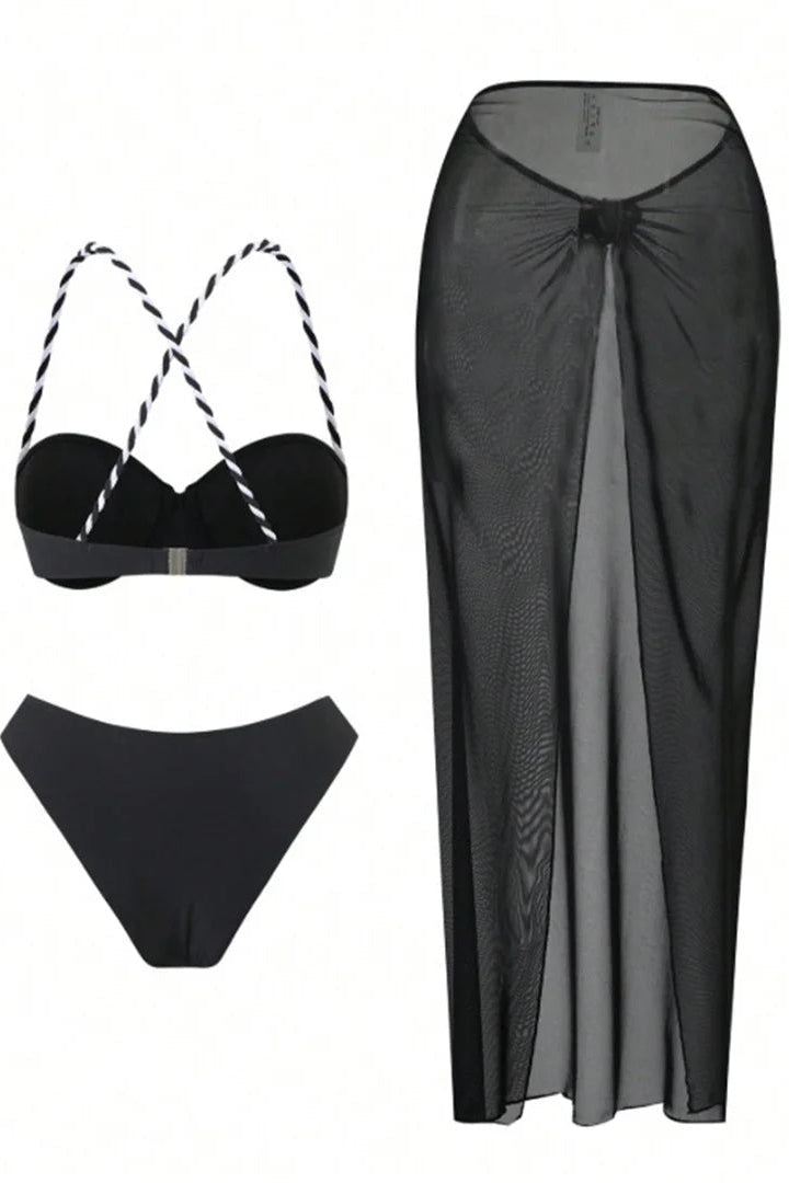 Black bikini set with a matching long black skirt