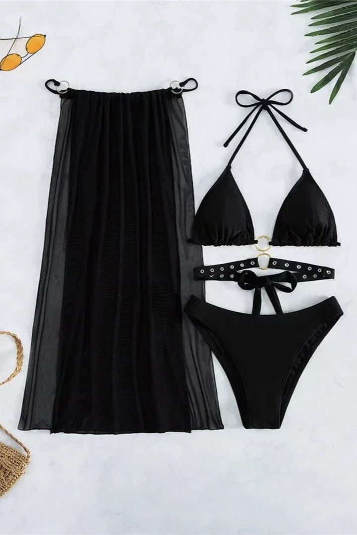 Black bikini set with matching skirt on a white background