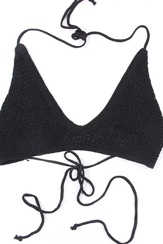 Black bikini top on a white background