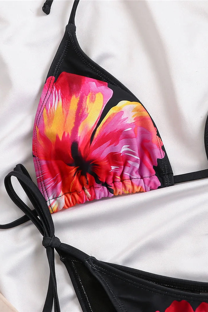 Black bikini top with colorful abstract floral design