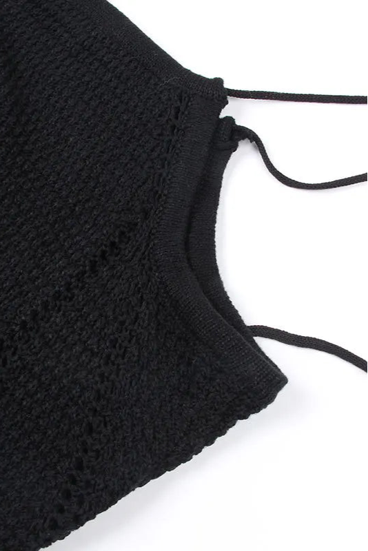 Black crochet top on a white background