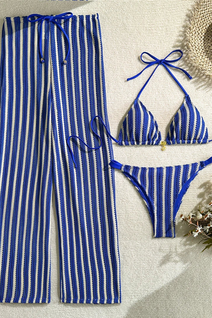 Blue and white striped bikini set Matching lightweight cover-up pants add versatile styling and effortless transition from beach to resort lounging.