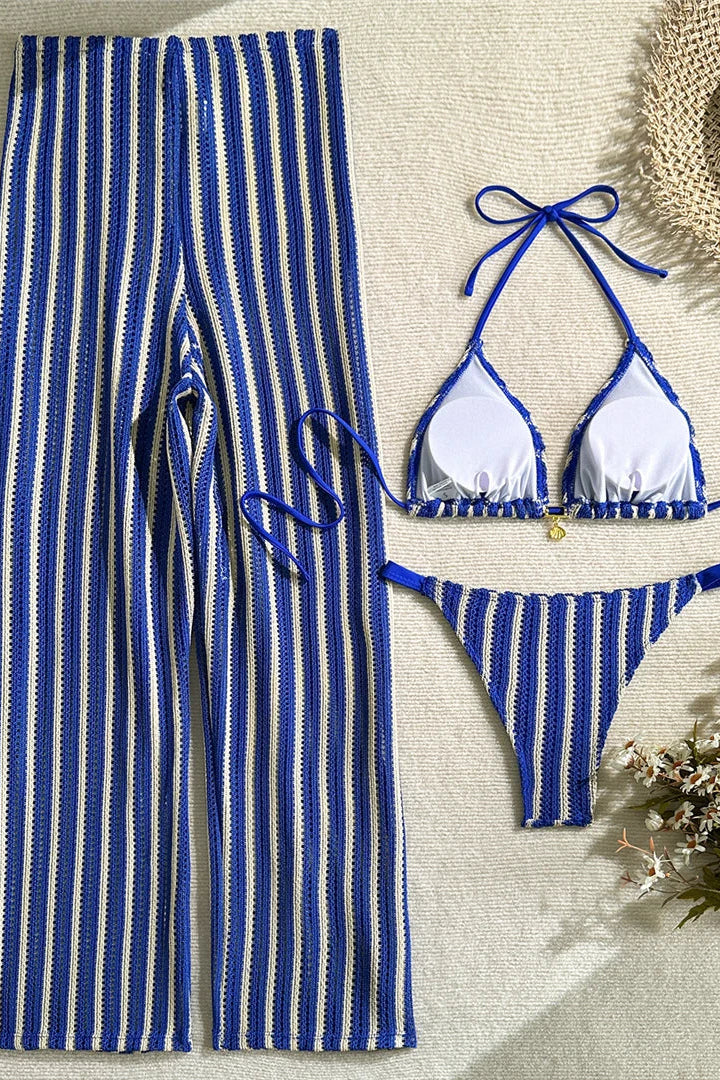 Blue and white striped bikini set with cover-up pants.