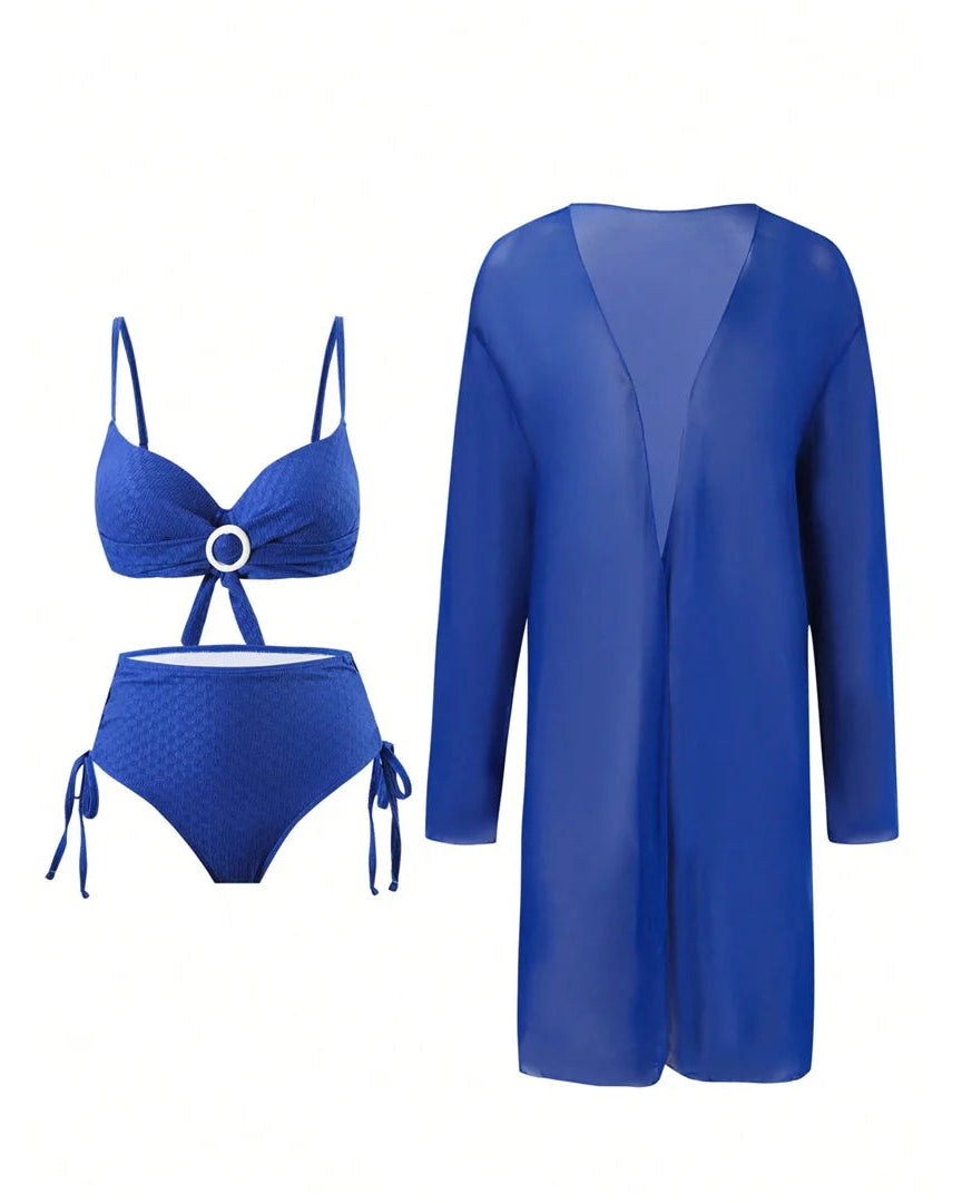 Blue bikini set and matching cover-up on a white background