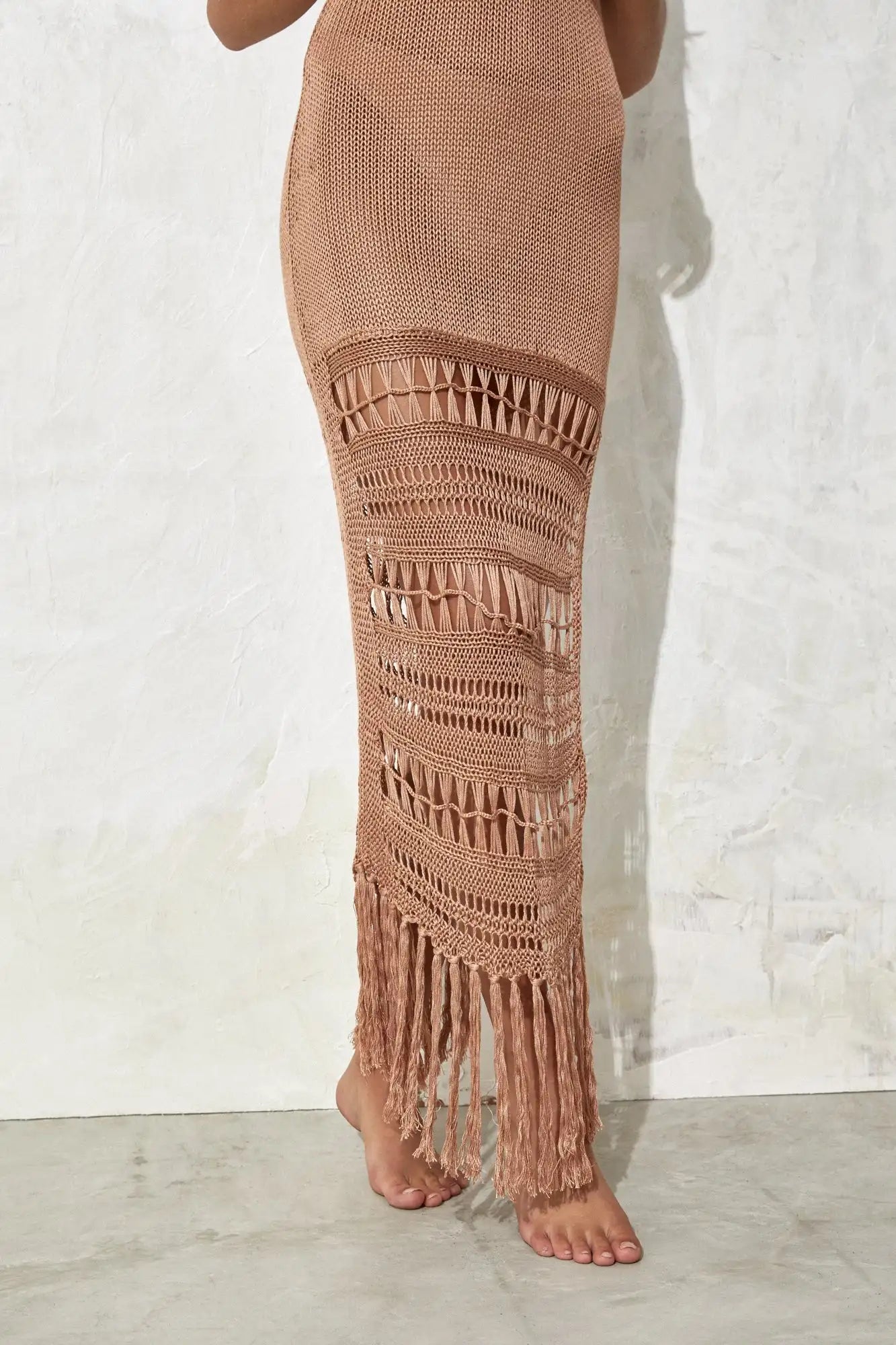 Brown crochet cover up with fringe on a white background