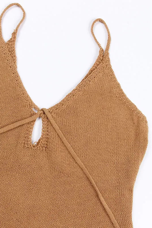 Brown knitted cover up on a white background