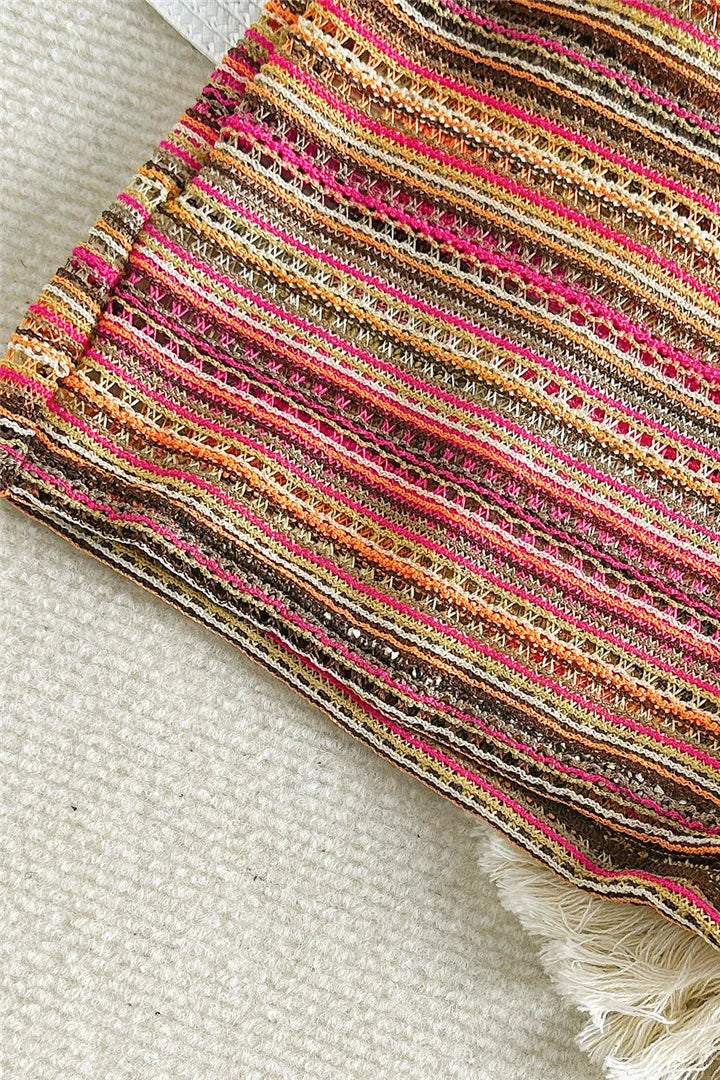 Close-up of a colorful striped swimwear on a textured surface