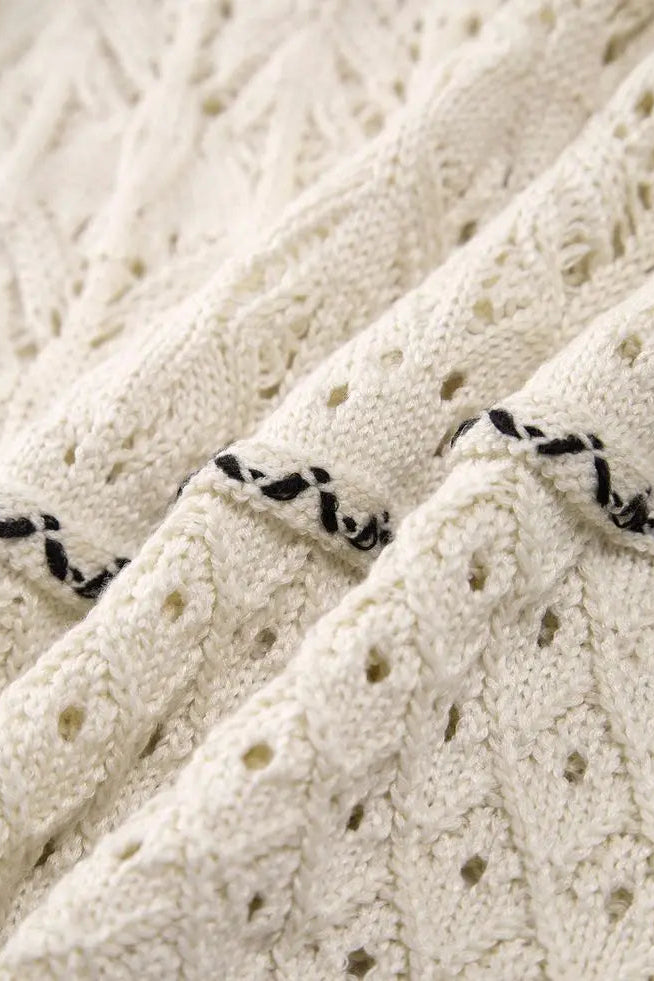 Close-up of a textured white fabric with black accents