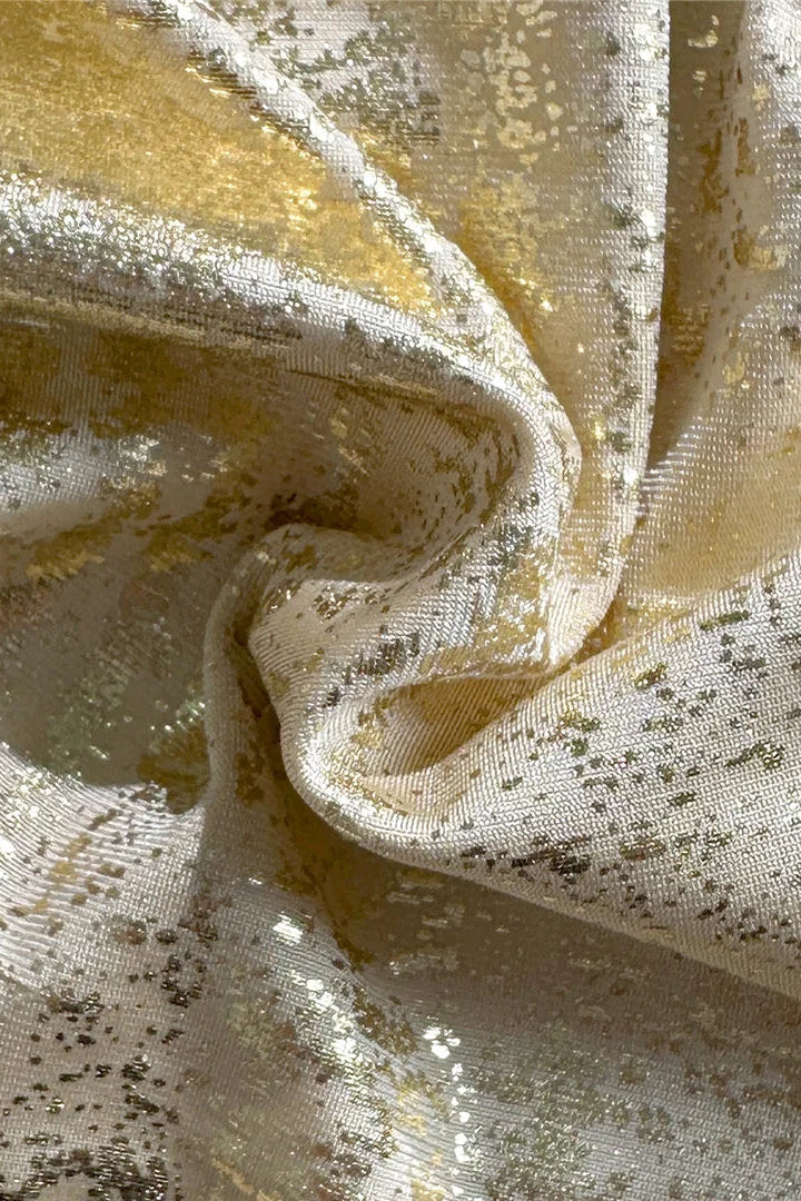 Close-up of gold metalic bikini set fabric