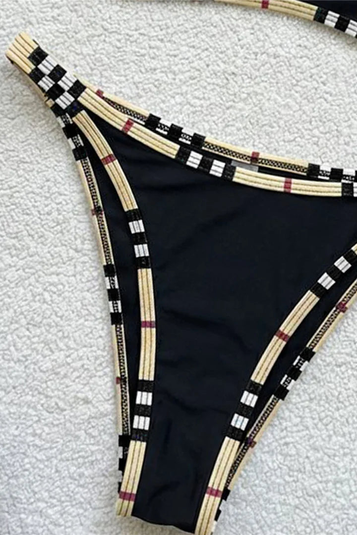 Close up of a black plaid trim bikini bottom