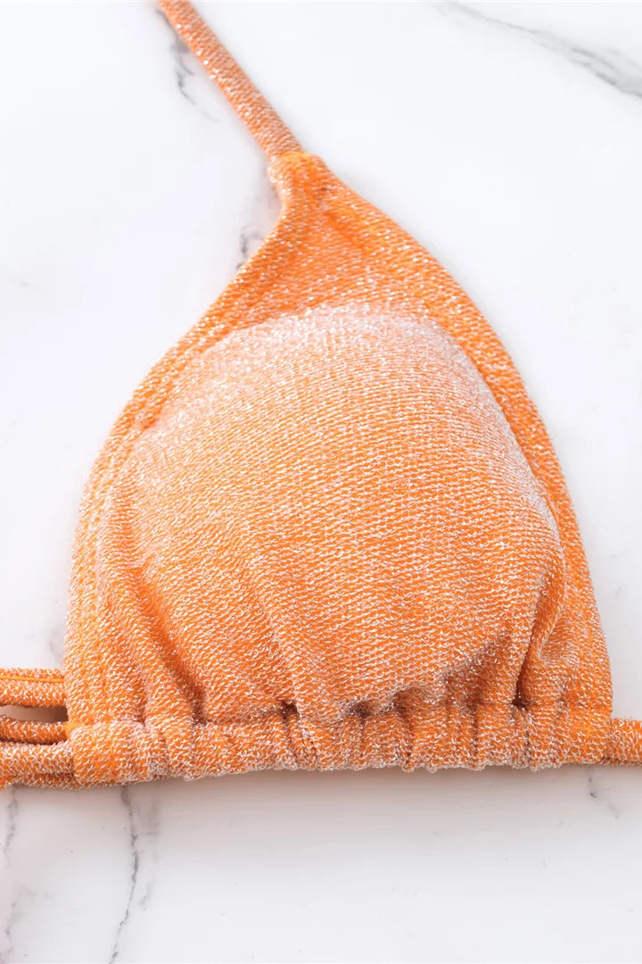 Close up of orange textured monokini 