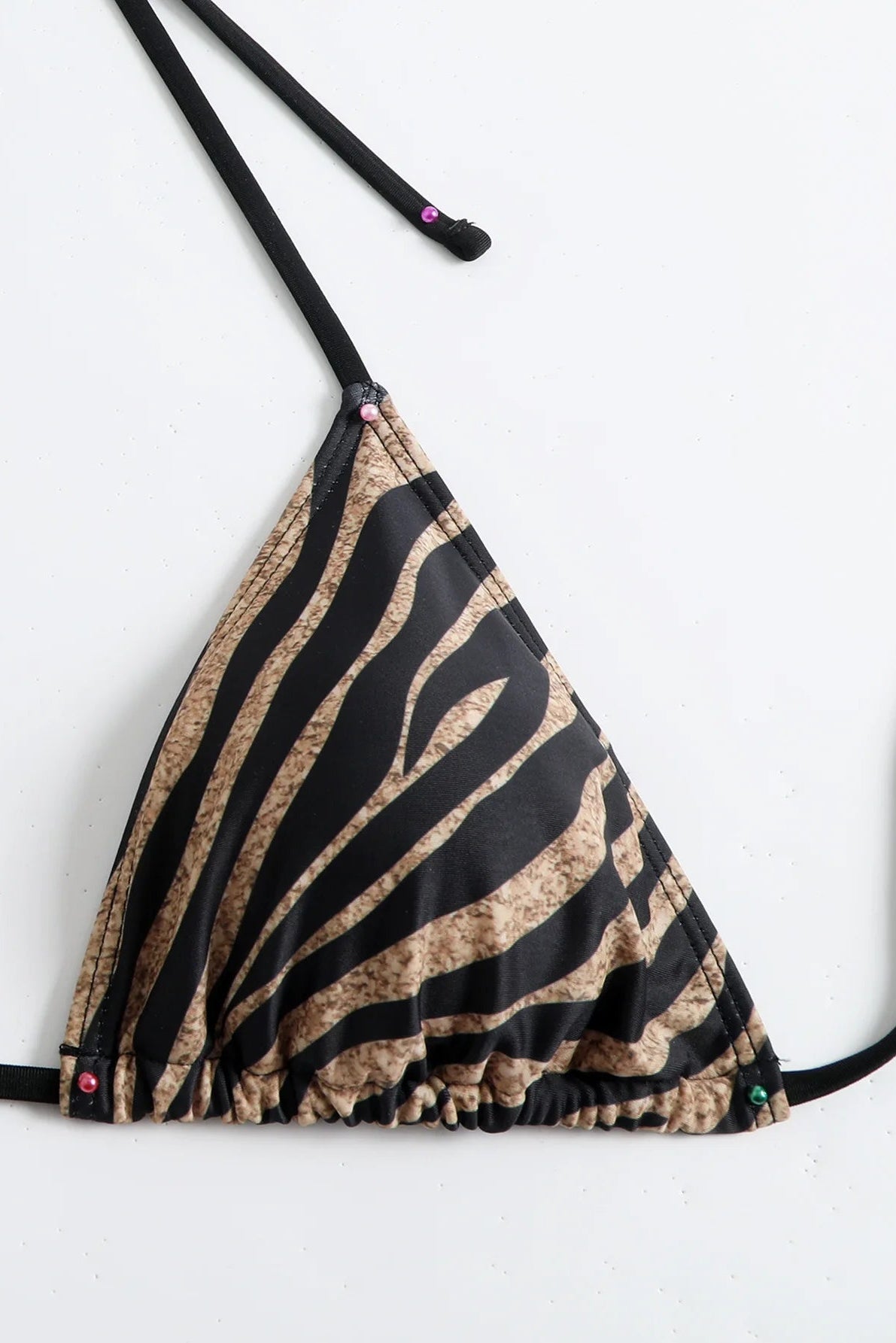 Close up of zebra print brown bikini top
