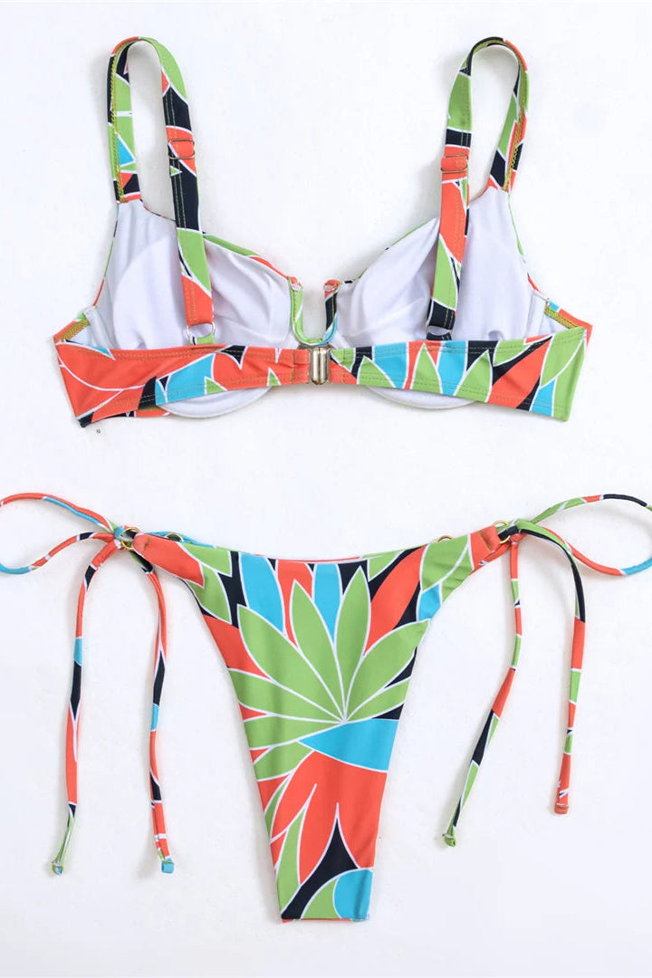 Colorful bikini set with geometric pattern on a white background