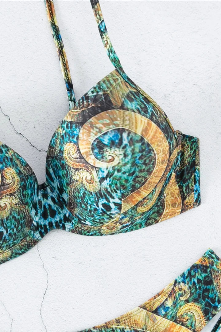 Colorful patterned bikini set on a textured white background