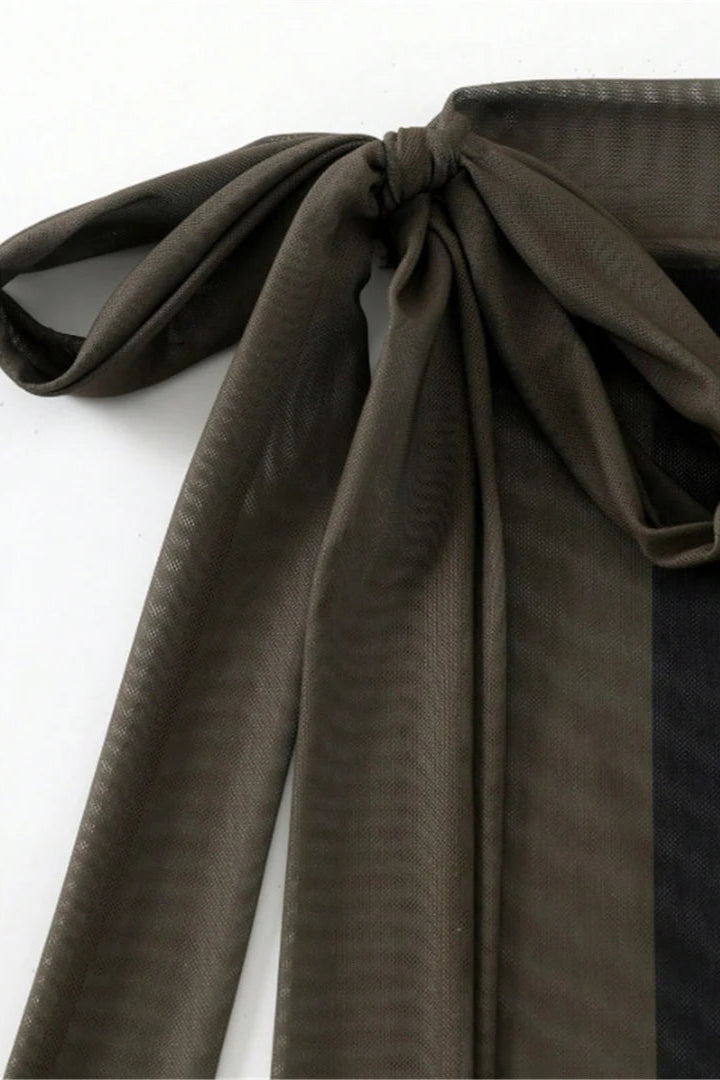 Dark fabric with a bow on a white background