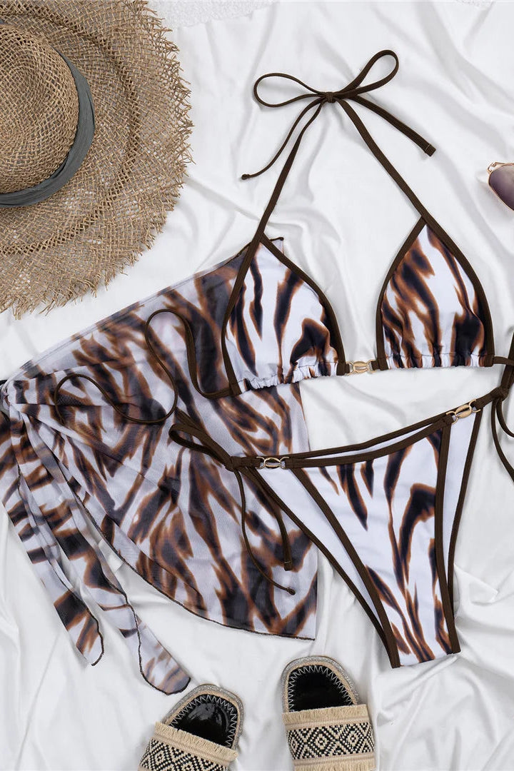 Flattering halter neckline creates a feminine and stylish swimwear silhouette perfect for vacations and poolside lounging.