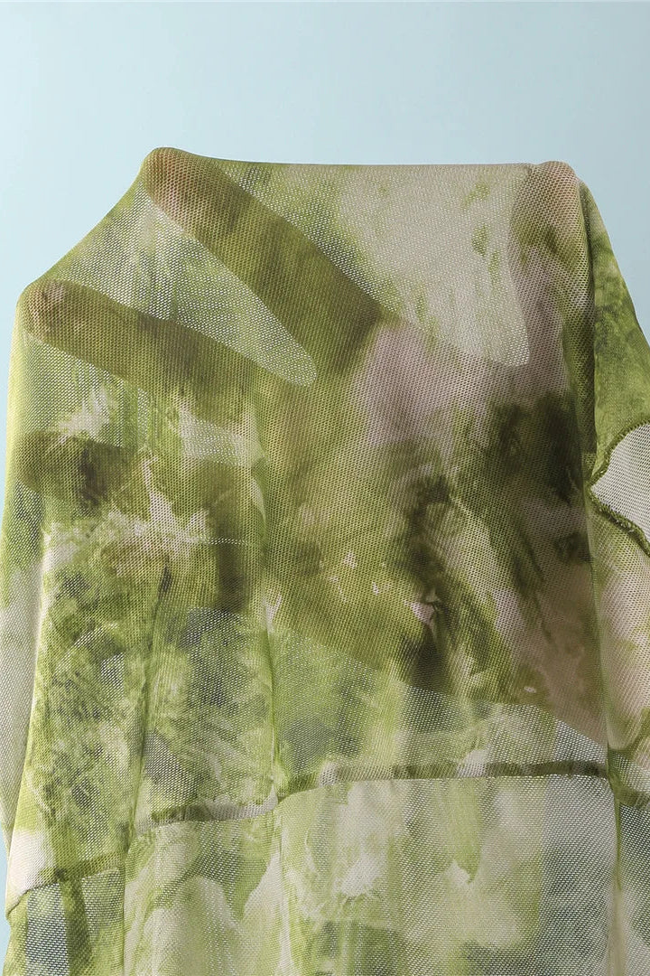 Green and white patterned fabric draped 