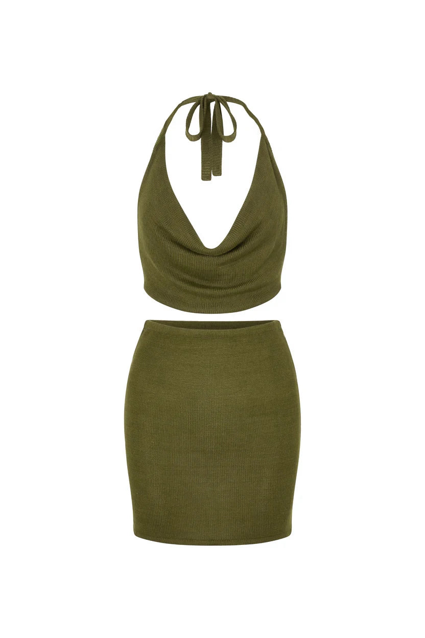 Green two-piece outfit set with halter top and skirt on a white background