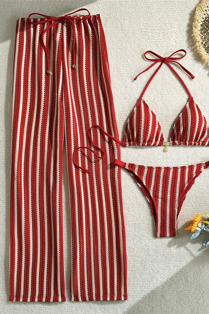 Matching lightweight cover-up pants add versatile styling and effortless transition from beach to resort lounging.