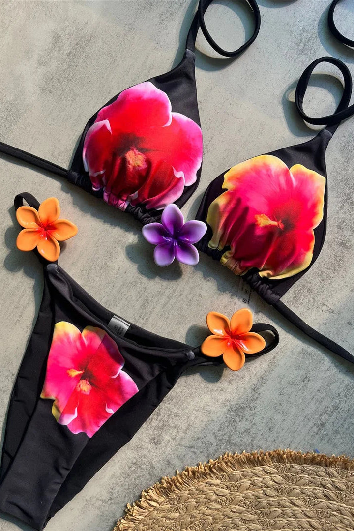 Raised three-dimensional flower accents add texture and a fashionable statement to the swimwear, creating an eye-catching vacation-ready look.
