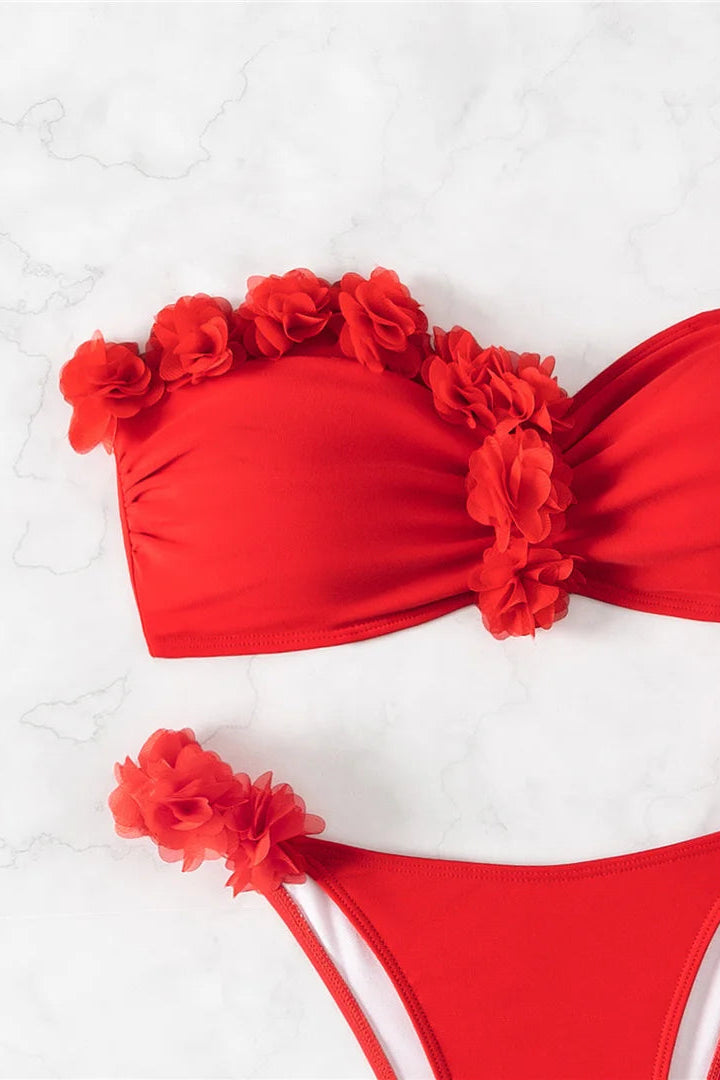 Red bikini with floral details on a white background
