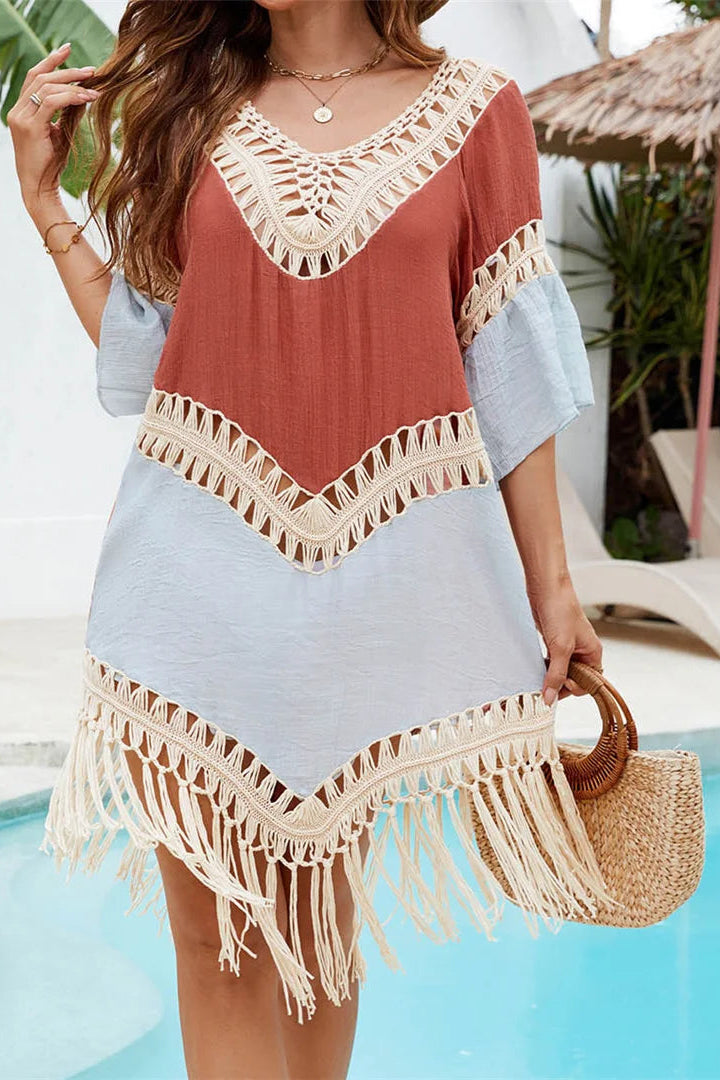 Sky and brown splicing creates artistic contrast with playful pom pom tassels hanging at back