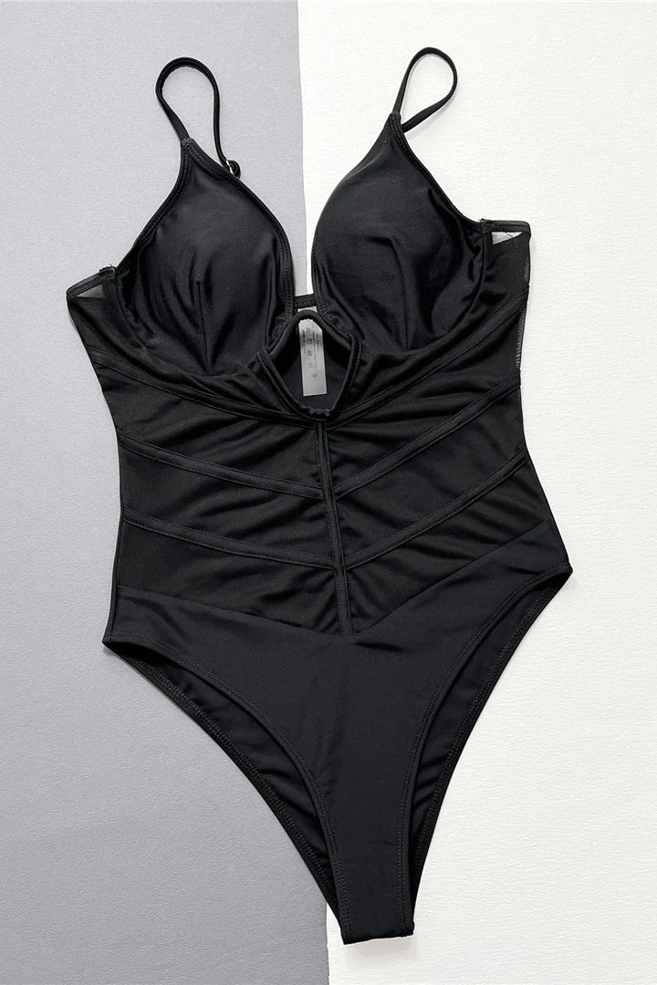 Solid black one piece with sheer splicing details