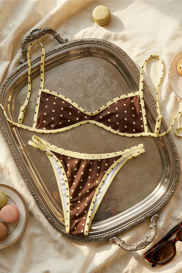 Trendy 2-piece bikini set featuring polka dots detailing with a sleek plain brown finish and butter yellow trim for stylish beachwear and resort wear looks.