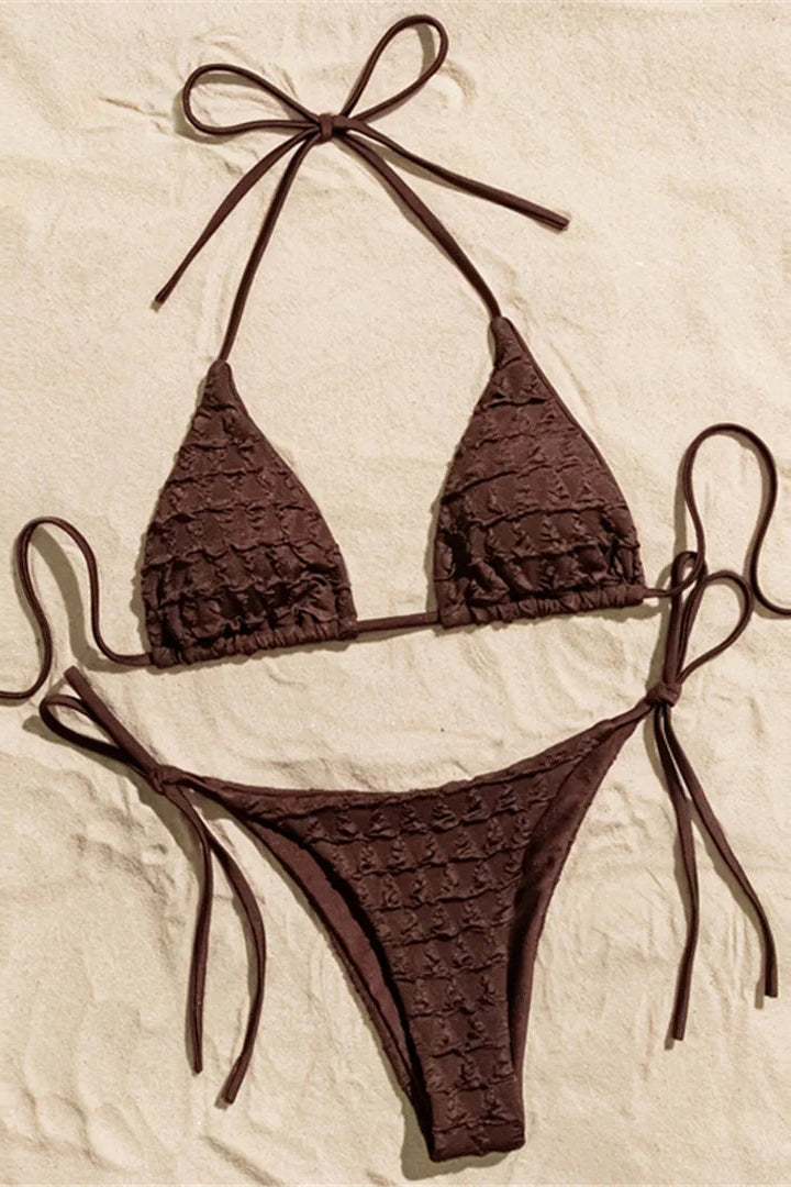 Trendy low-rise bottoms with lace-up detailing add an adjustable and fashion-forward touch.