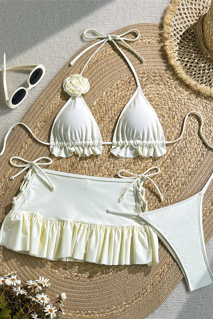 White bikini set with matching top and bottom and cover up mini skirt