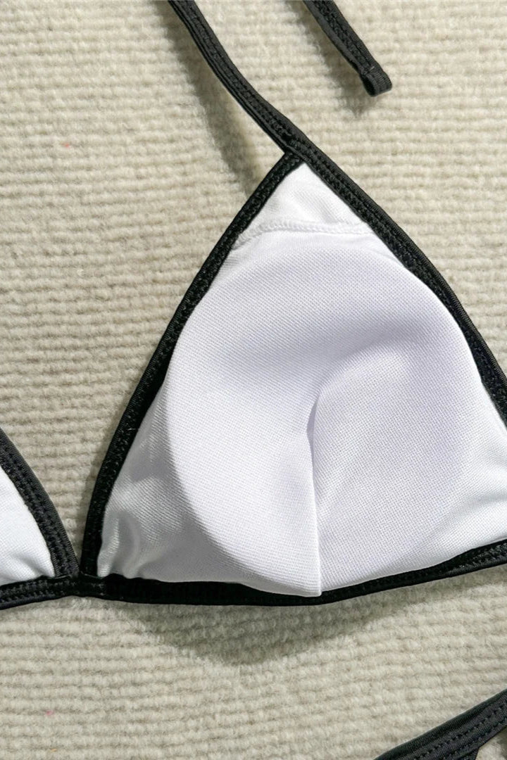 White bikini top with black straps 