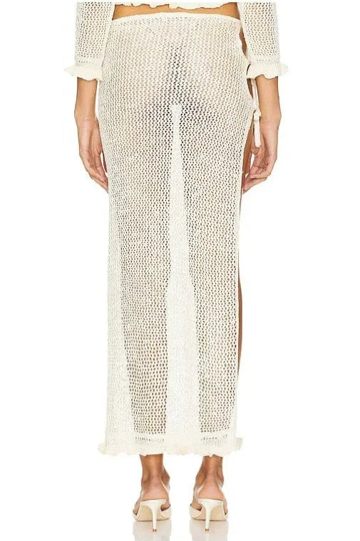 White knit skirt with a high slit on a white background