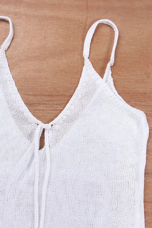 White knitted tank top on a wooden surface