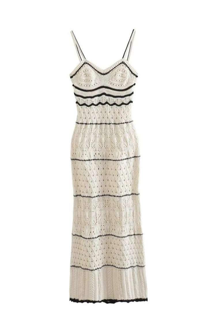 White lace dress with black accents on a white background