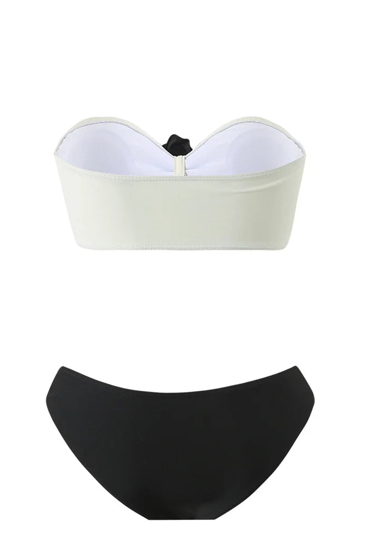 White strapless top and black high-waisted bikini bottom