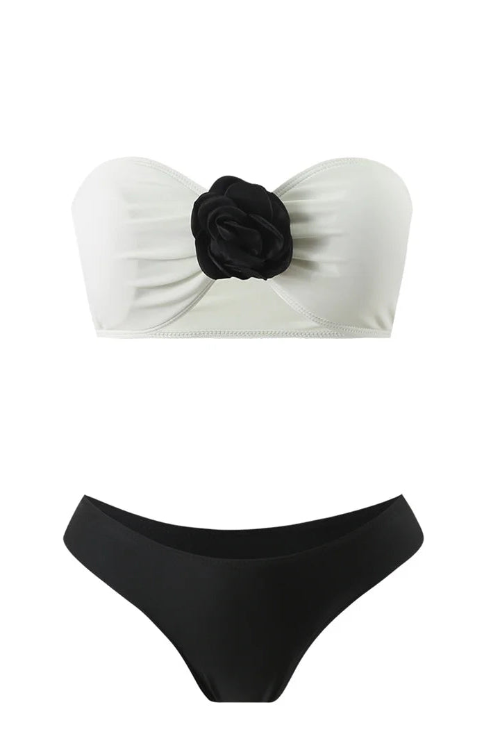 Wire-free bandeau style adorned with eye-catching 3D floral accents and black bottom
