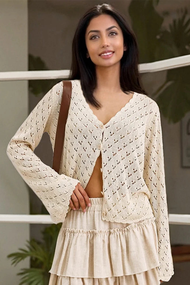 Woman wearing a beige lace cardigan cover up