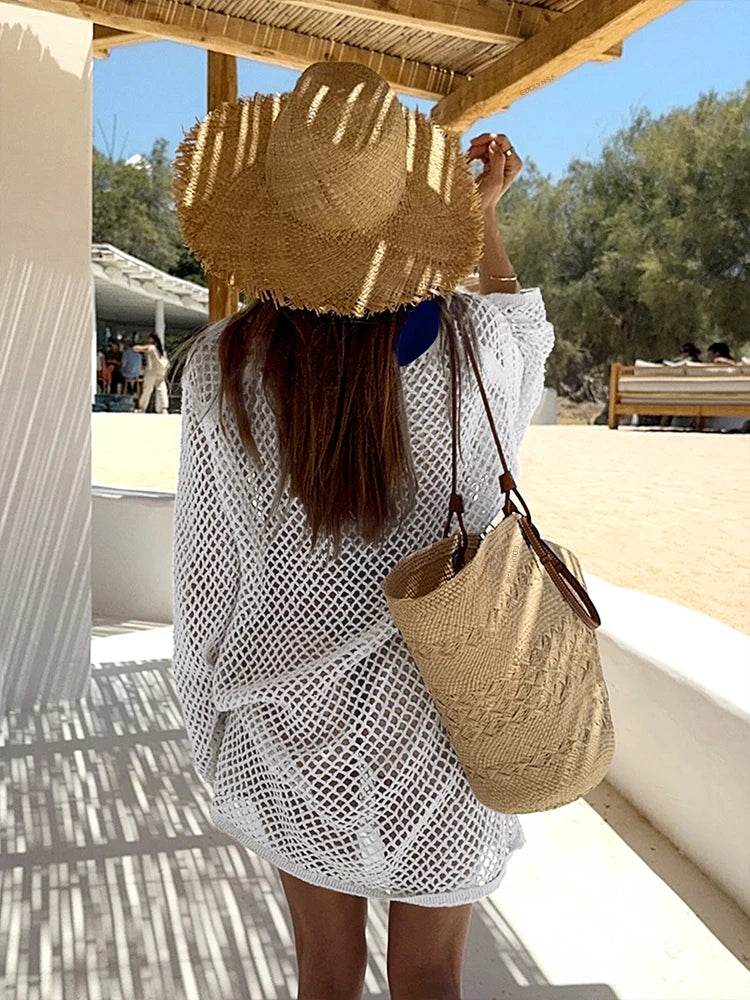 Woman wearing a cover up mesh see through dress