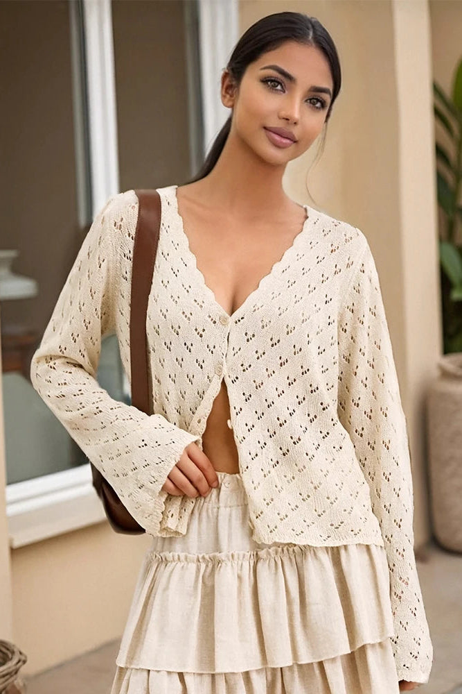 Woman wearing a cream-colored lace cardigan
