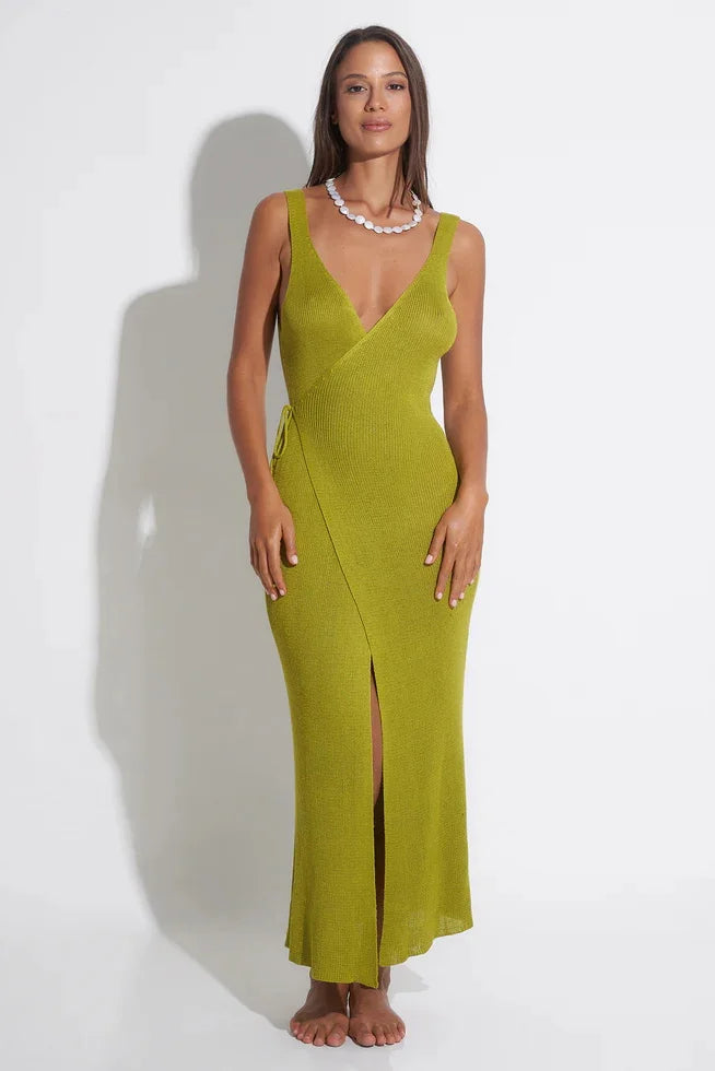 Woman wearing a green dress with a white background