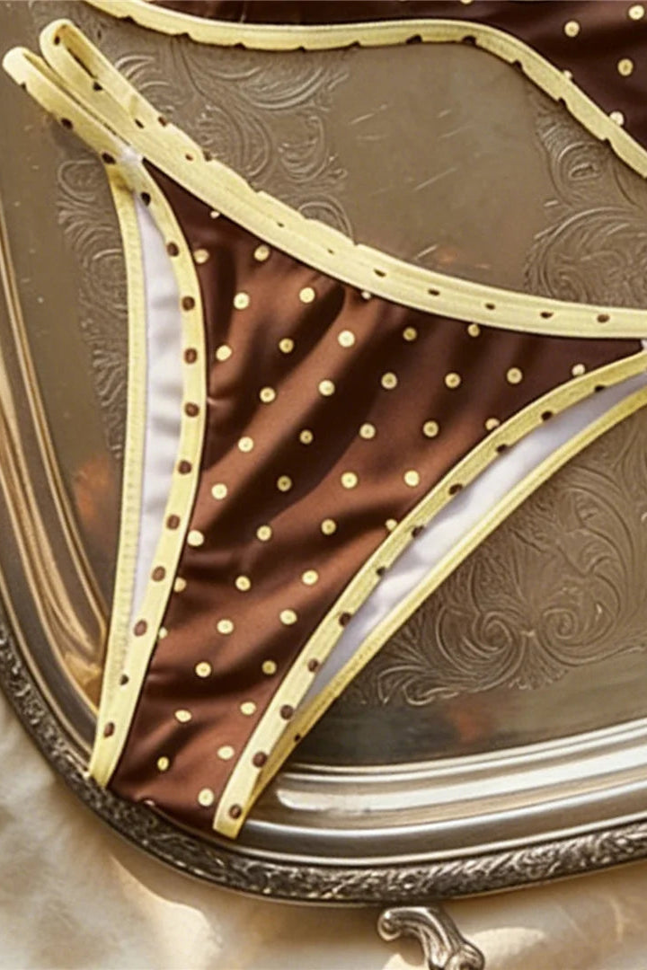 Yellow trim on a brown base bikini bottom with polka dots print