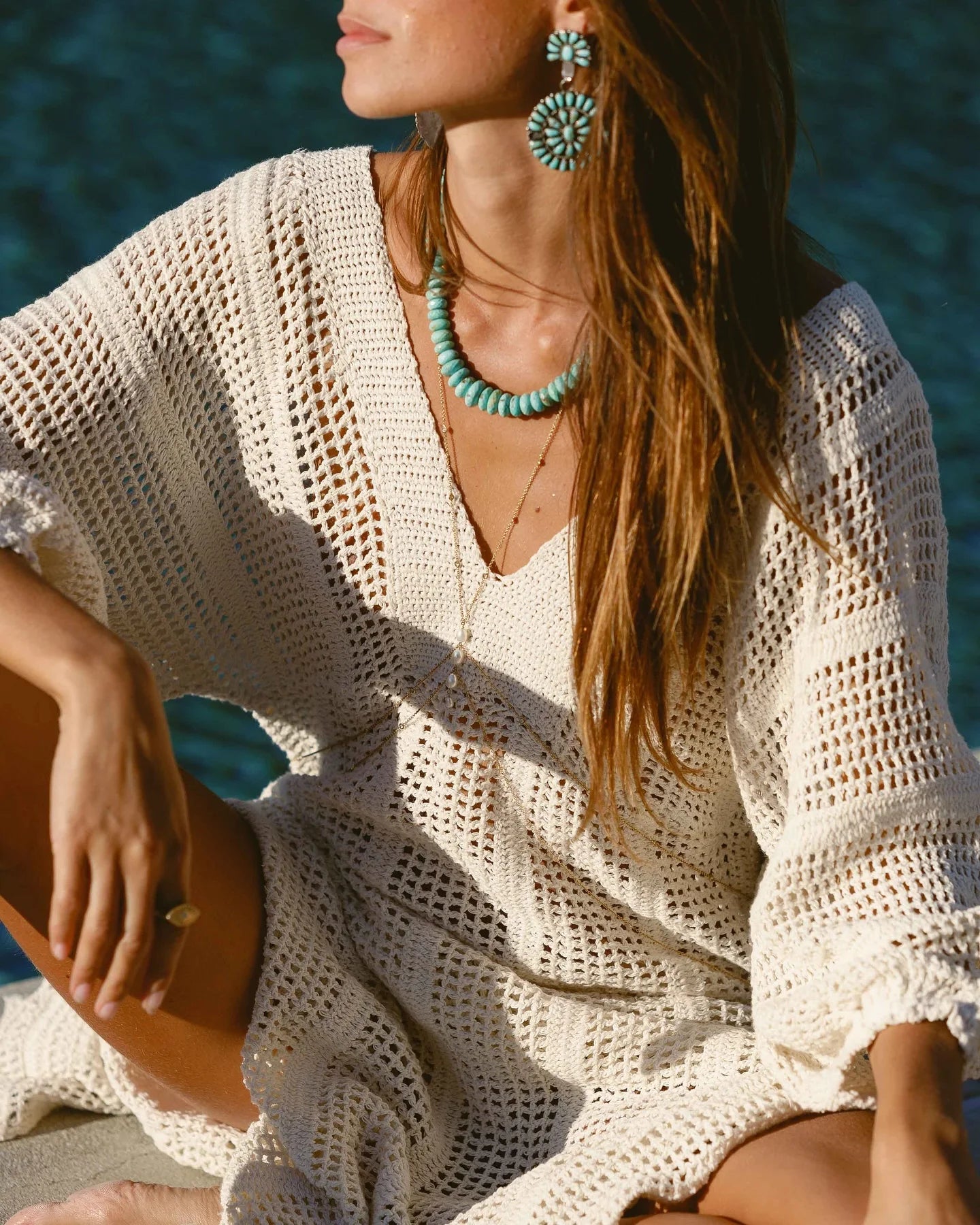 women  wearing white Knit Cover-Up Maxi Dress with blue earrings